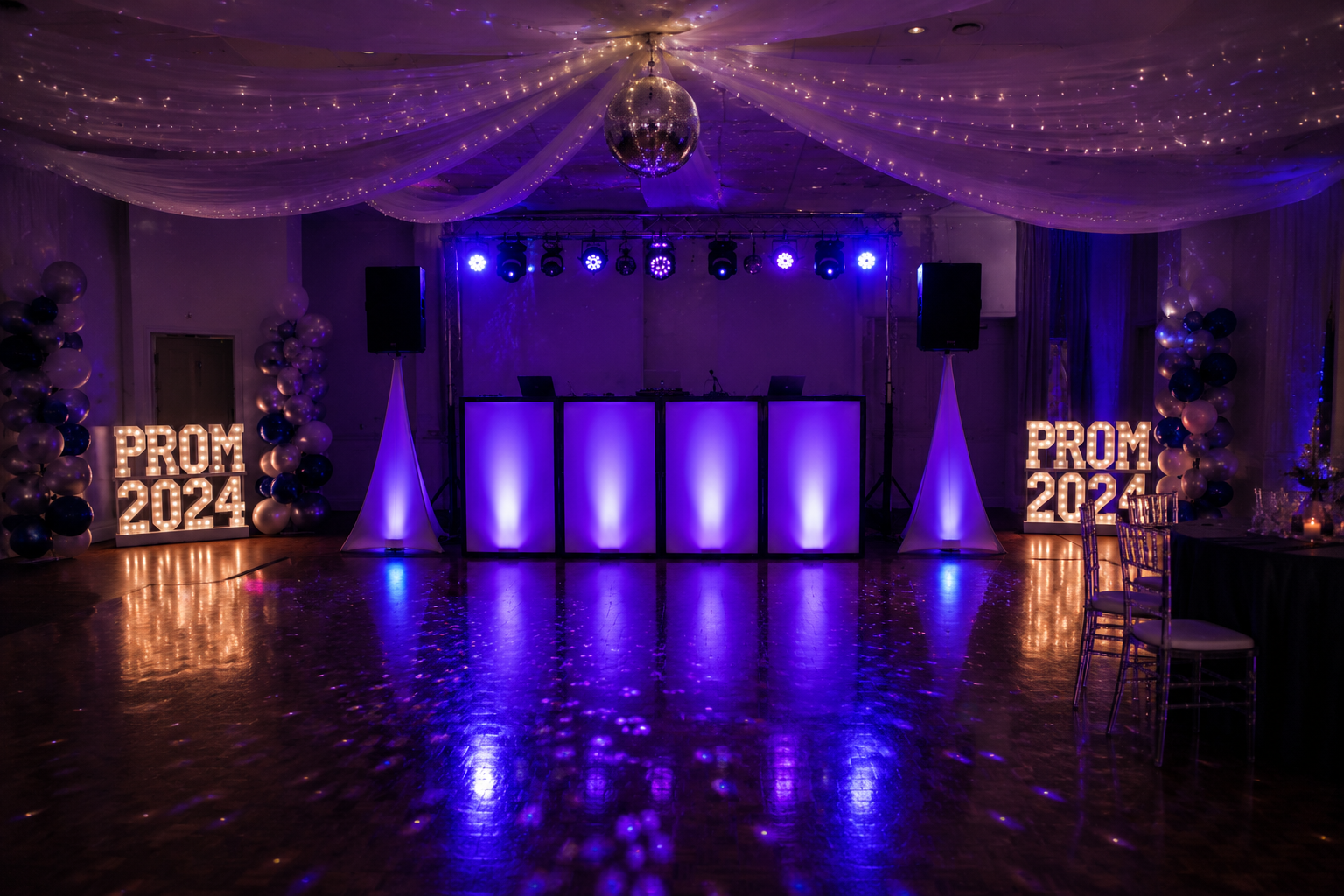 School prom DJ setup with disco ball, uplighting and PROM marquee letters